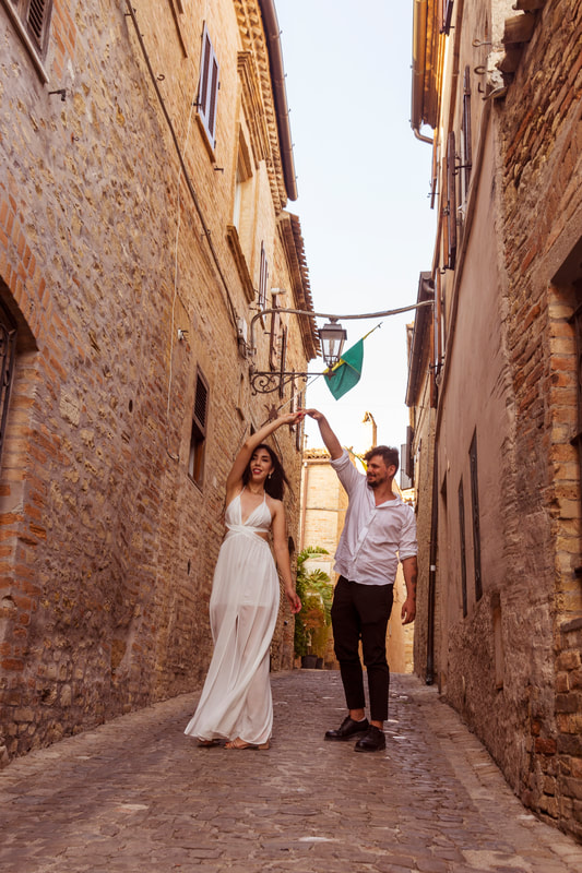 A couple dancing in a small Italian village