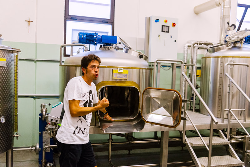 Italian guy explain how to brew beer inside his brewery DueP at Monte Urano Marche Italy